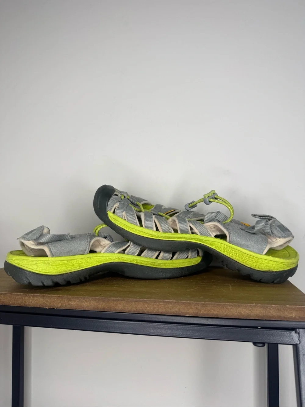 women's Keen Whisper sandals in a neutral gray and bright green colorway